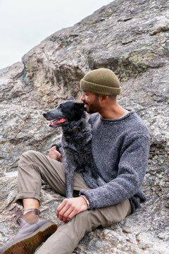 man sitting with dog
