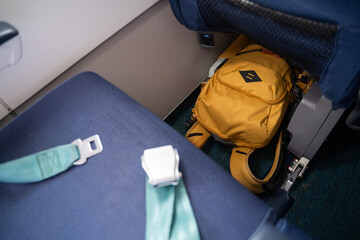Backpack under airplane seat