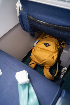 Backpack under airplane seat