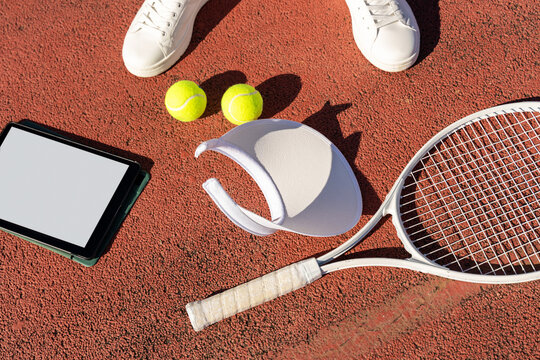 Tennis Gear with Blank Tablet on Court


