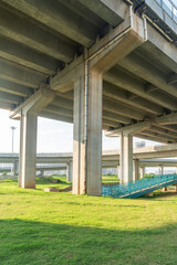 Looking up at a Large Interstate Highway Overpass and Blue Sky