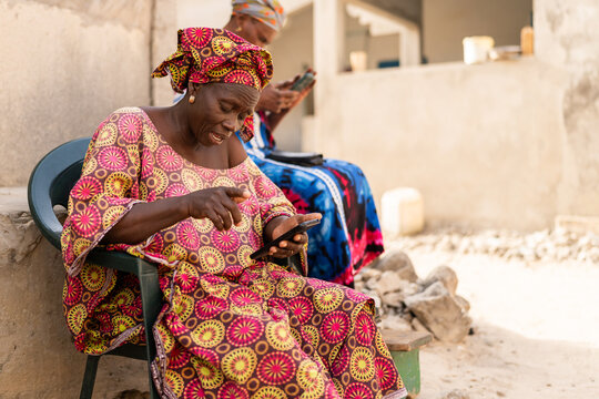 Senegalese women using mobile phones in Dakar, Senegal