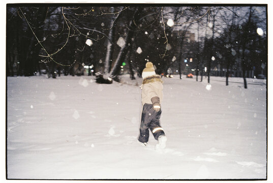 Child Running in the Snow
