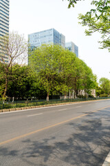 Fototapeta premium Empty urban road and buildings in the city