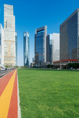 Naklejka premium city park with modern building background in shanghai