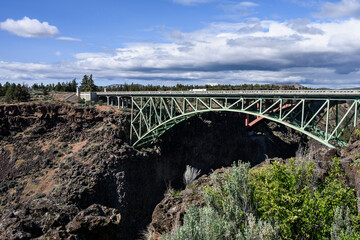 Two highway bridges over the crooked river gorge in central Oregon, scenic day for spring travel
