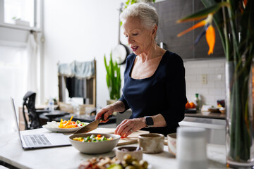 Senior Woman Preparing Food in a Modern Kitchen
