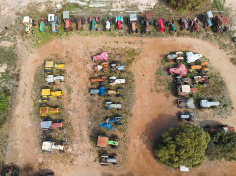 Colorful old tractors parked in rows