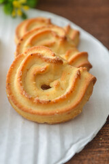 close up of butter cookies on a wooden table