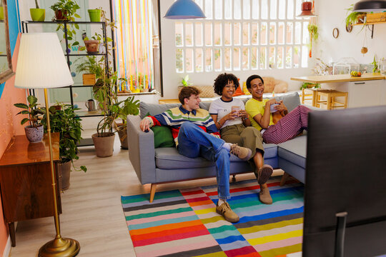 Roommates enjoying a movie at home