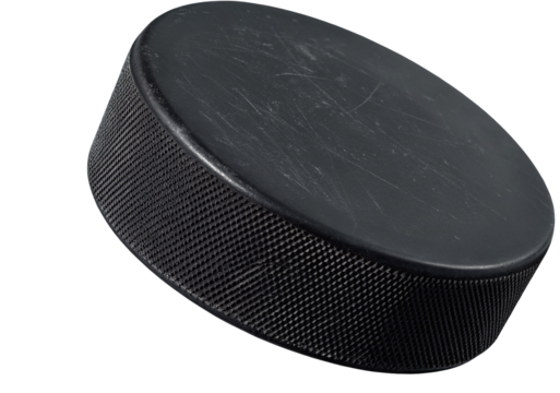 A close up studio shot of a black hockey puck on a black background with a slight angle and texture