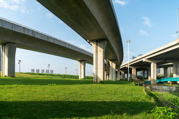 Concrete structure and asphalt road space under the overpass in the city
