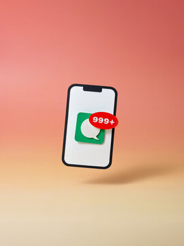 A smartphone displays a chat icon with over 999 unread text
