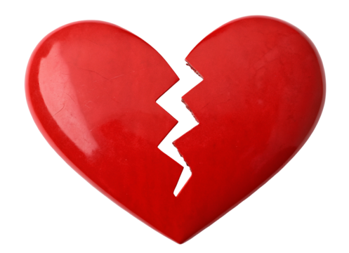 A glossy red heart split in two with a jagged black line against a solid black background studio shot