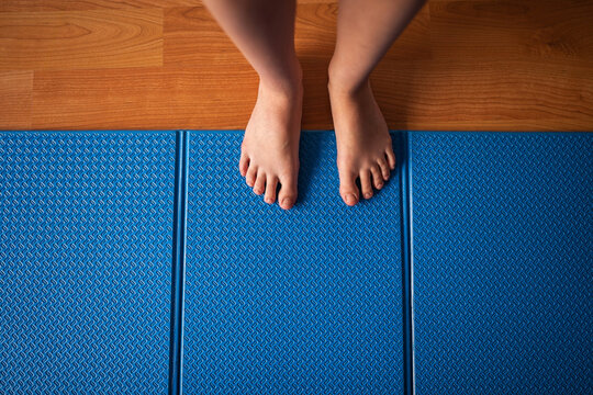 Top view of woman on yoga mat