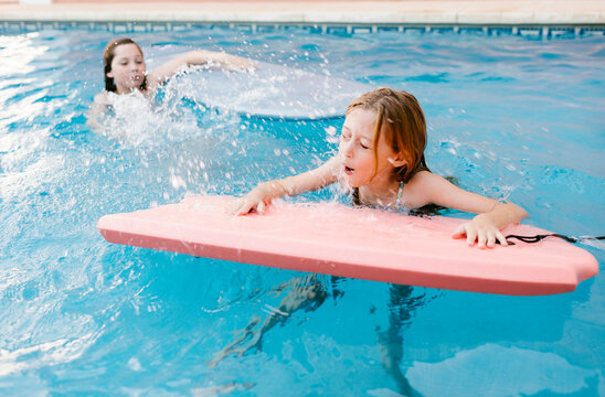 Girl hit by splash in pool