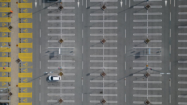 Lone Car in an Empty Parking Lot