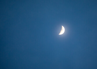 Half moon in blue sky, dreamy relaxing