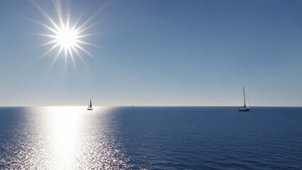 Calm Ocean View with Sailboats under Bright Sunshine in Summer Day