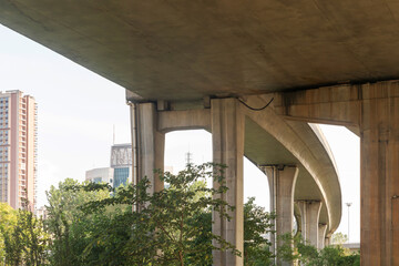 Looking up at a Large Interstate Highway Overpass and Blue Sky