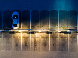 Aerial View of Parking Lot with Charging Stations at Night