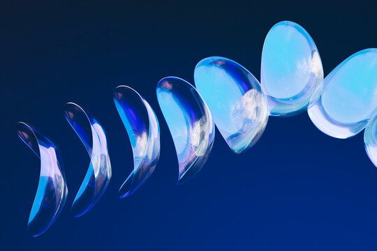  Minimalist abstract glass forms arranged in blue fluid spiral