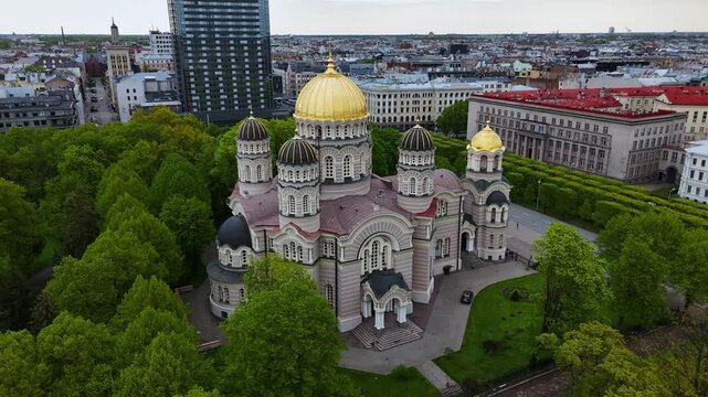 Nativity cathedral, riga with lush esplanade park in spring, aerial view
