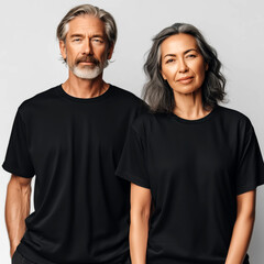 Middle aged models, couple matching black t-shirt mockup. Woman and man, wife with husband, grandma and grandpa. Casual crewneck short sleeve tee mockup. Family holiday, parents mockup
