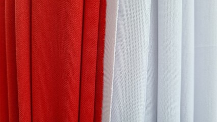 Indonesia Flag red and white fabric textile background. National symbol Indonesia independence day background. Patriotic design for banner, poster, greeting card. Vibrant colors national pride unity.