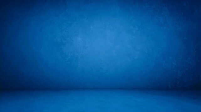 Empty studio space background features a dark blue plastered wall and floor, perfect for product photography or virtual renderings