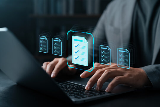 Businessman using laptop with digital checklist icons on screen, representing task management, document workflow, productivity, data organization, and digital business solutions.
