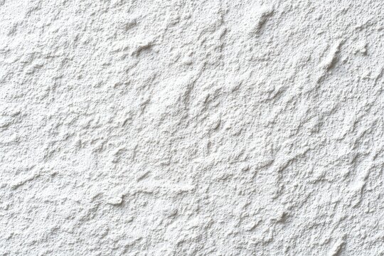 Close-up of a textured, off-white surface with a rough, uneven, and slightly grainy appearance; showing subtle diagonal lines and varied depths