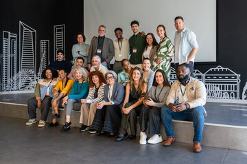 Diverse group posing at a modern corporate event