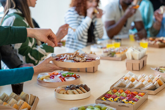 Office catering brunch with diverse appetizers and snacks