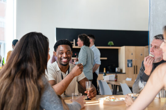Social gathering in a modern office setting