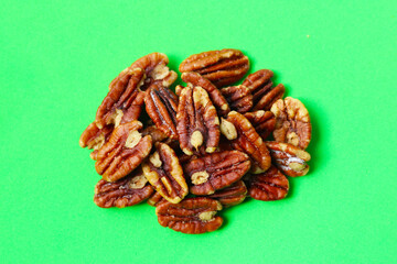 Delicious salted pecan nuts scattered.