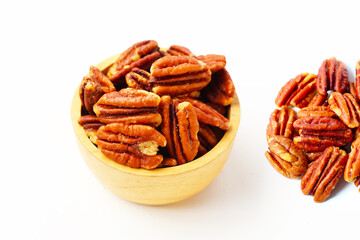 Delicious salted pecan nuts scattered.