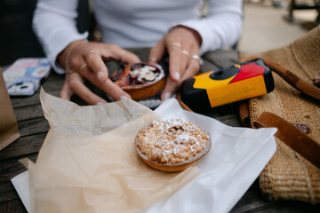pastry on table with disposable camera in background 