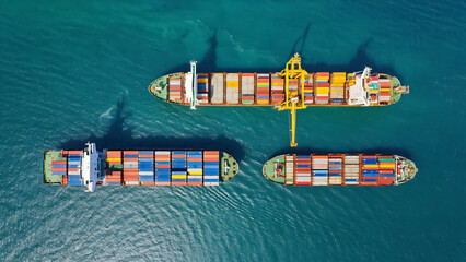 Aerial view of Large cargo ship with port area.Shipping logistics with sea freight indutry.Global import and export.T