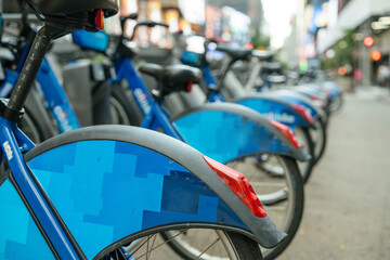 Shared Bikes stationed on a busy New York street. A sustainable transport option for locals and tourists.