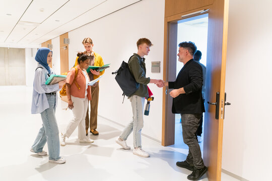 Students Entering To The Classroom