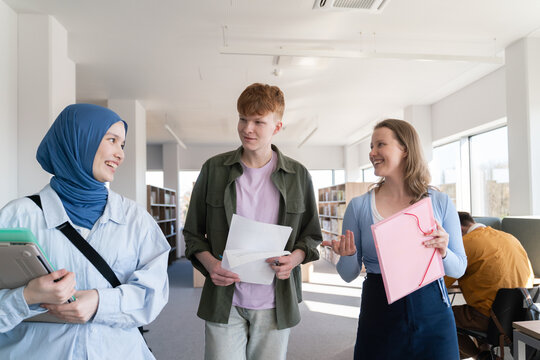 Students Coversation in University Library