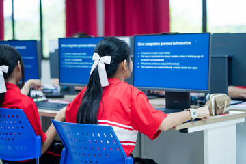 Blurred Student study in class computer technology at the elementary school. Education concept.
