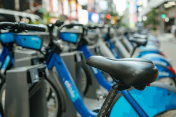 A long row of Bikes docked at a station in New York. Perfect for eco-friendly commuting and exploring the city.