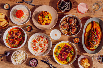 Table full of Peruvian food at a restaurant