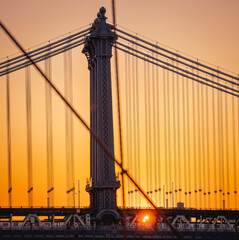 bridge at sunset sun reflection train Manhattan 