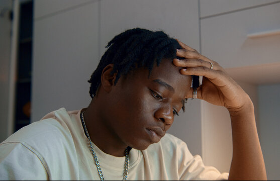 Young man feeling sad and depressed at home