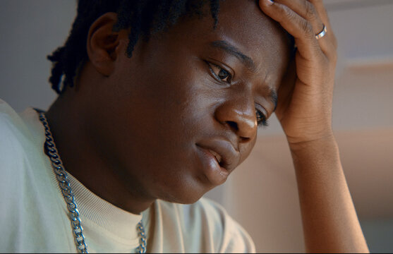 Young man feeling sad and depressed at home