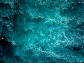 Top down aerial view of moody ocean wave