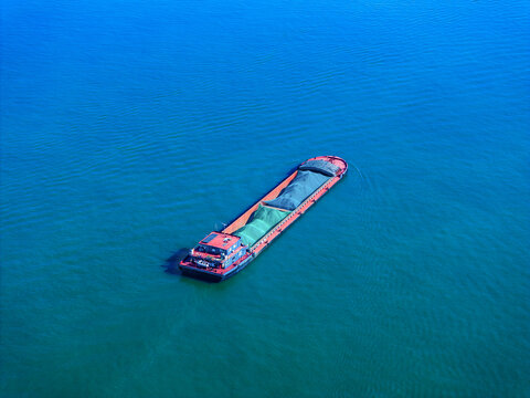 Sand Carrier Sailing on Water
